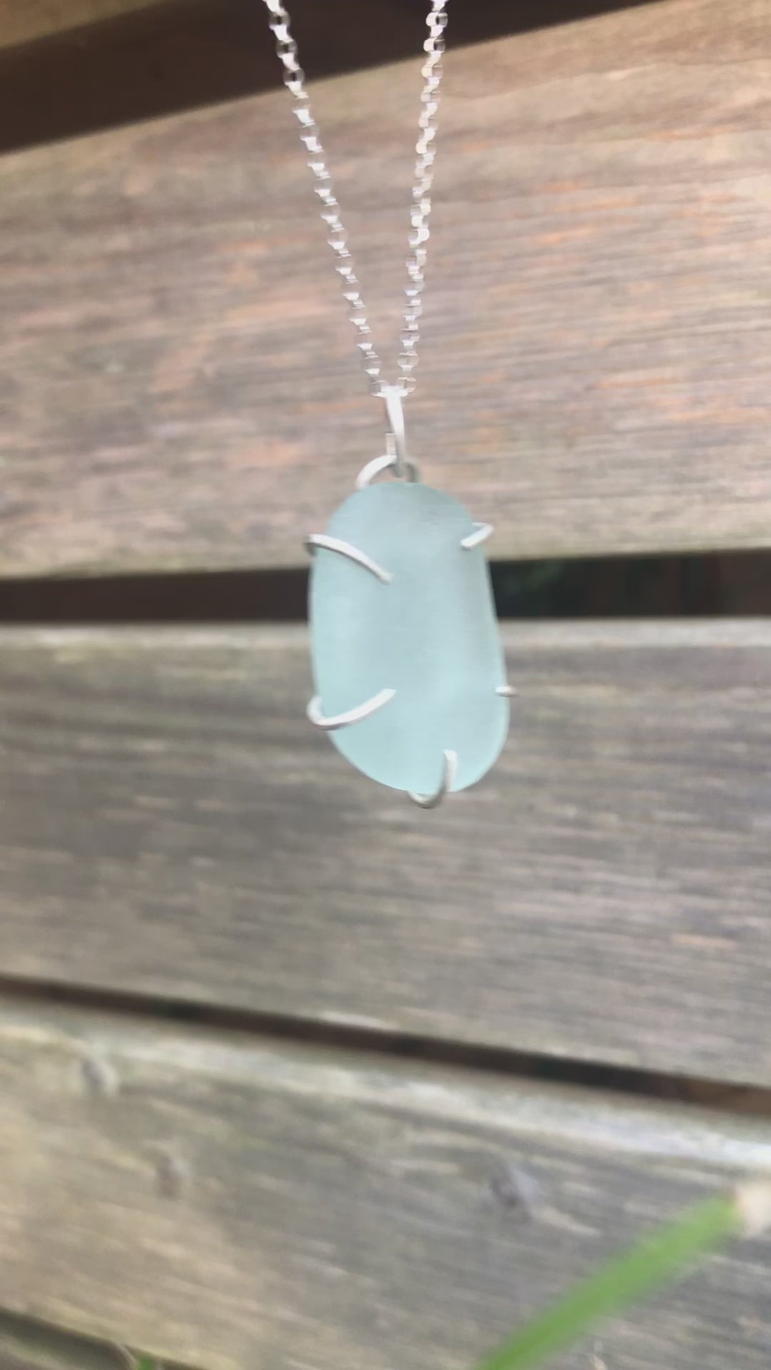 Handcrafted sterling silver pendant with luminous aqua genuine sea glass in a claw setting, eco-friendly and unique handmade ocean-inspired jewellery. Relic Jewellery UK